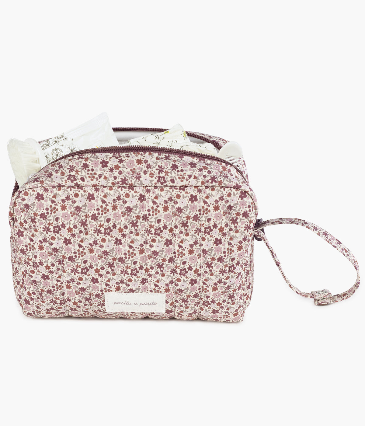 Necessaire Cherry Flowers da Pasito a Pasito aberta com artigos de bebé.