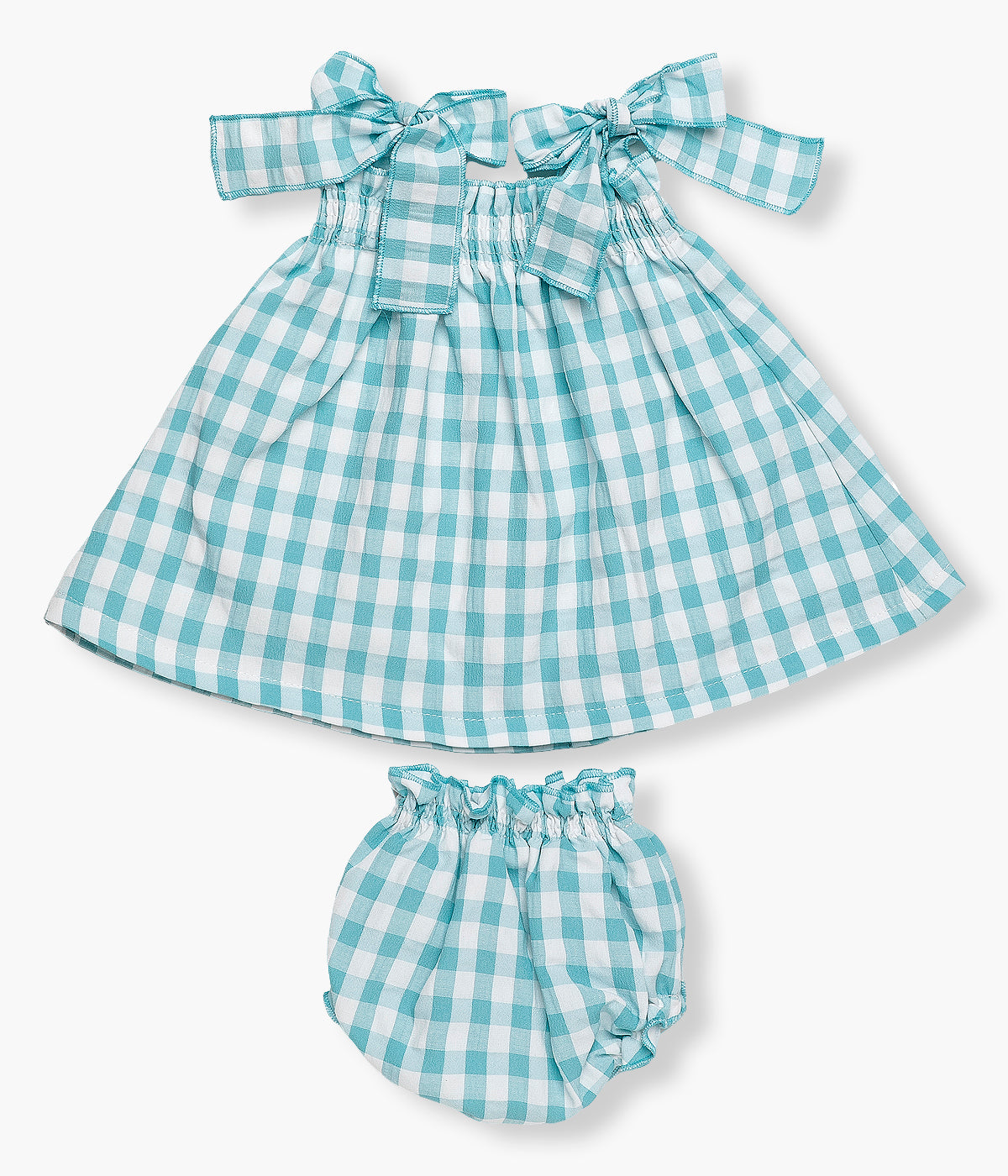 Vista de frente do conjunto com padrão vichy azul da Juliana para bebé menina e recém‑nascida, composto por vestido e tapa fraldas. Vestido de alças com laços nos ombros e elástico no peito. Tapa fraldas a combinar.
