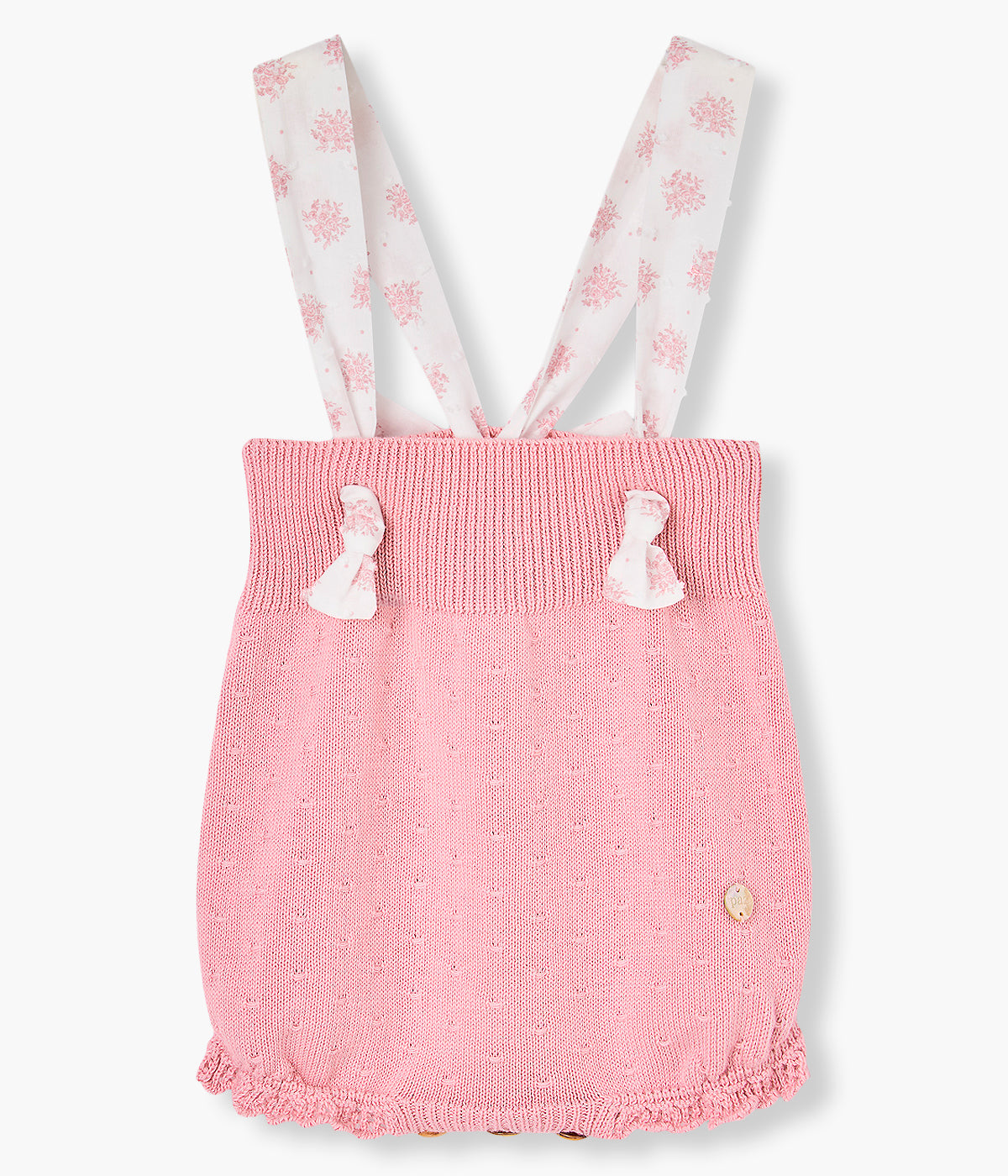 Fofo em malha de algodão rosa da Paz Rodríguez para bebé menina e recém-nascida. Delicado fofo com alças e laço em tecido plumeti branco com flores e detalhes na malha.