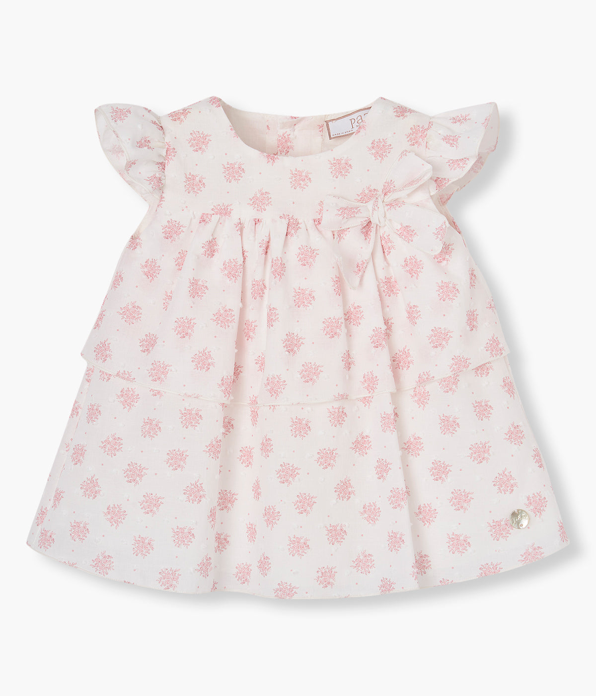 Vista de frente do vestido e tapa fraldas branco da Paz Rodríguez para bebé menina e recém-nascida, 100% algodão.