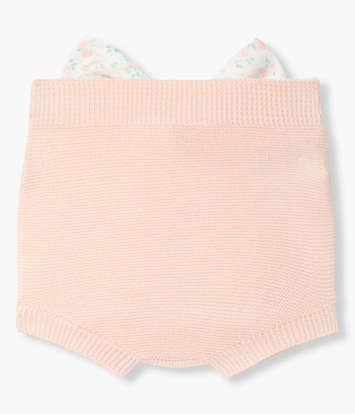 Vista de costas do tapa fraldas em malha de algodão orgânico rosa da Wedoble para bebé menina e recém-nascida. Delicado tapa fraldas com grande laço branco com padrão floral nas costas.