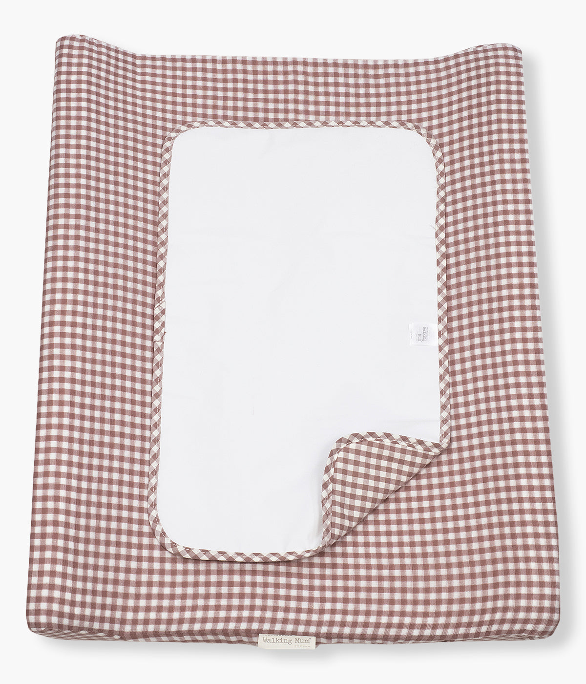 Trocador de Fraldas Praliné Vichy Moka da Walking Mum. Prático trocador com padrão vichy em tons de rosa que oferece um espaço confortável e seguro para mudar a fralda da bebé em casa. Com espuma viscoelástica, base antiderrapante e capa removível impermeável, combina funcionalidade, higiene e um design delicado que harmoniza com o quarto da bebé.