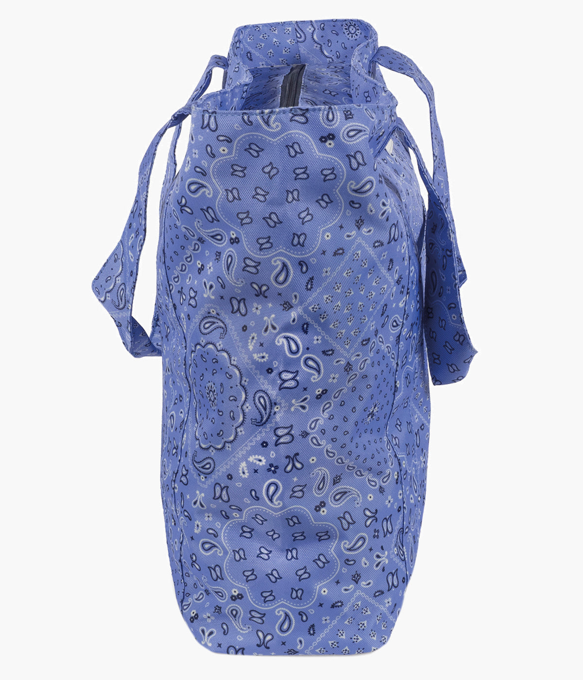 Vista lateral da bolsa para a praia Bandana da Walking Mum para bebé. Prática bolsa ideal para os dias de praia, piscina ou passeios em família. Leve e resistente, oferece grande capacidade de arrumação e uma base em rede pensada para evitar a acumulação de areia no interior.