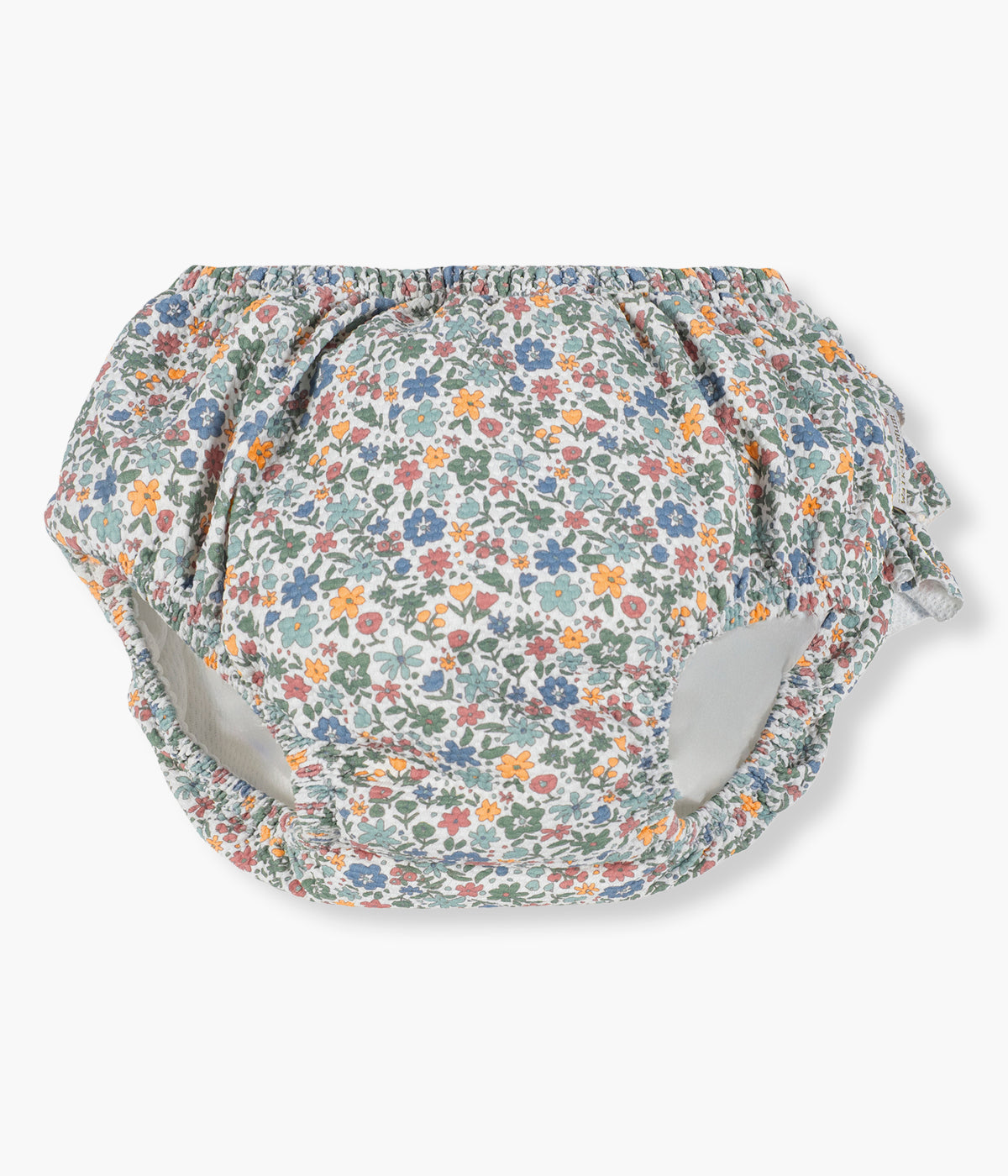 Vista de frente da cueca de banho anti-UV para bebé Summer Flowers da Walking Mum. Prática cueca com padrão floral que permite à bebé aproveitar a praia e a piscina com conforto, proteção e segurança. Com proteção solar FPS/SPF 50+ e sistema anti-fugas integrado, é perfeito para mergulhos no verão.