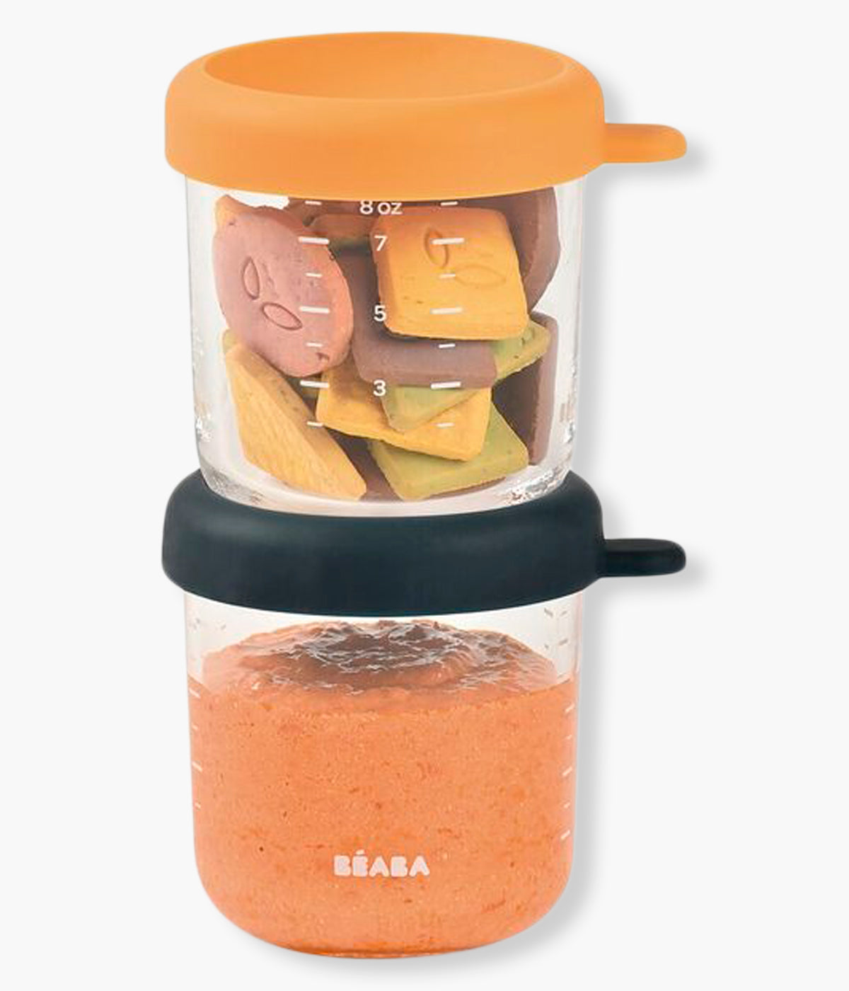 Vista frontal do conjunto de 2 recipientes de vidro Béaba com capacidade de 250ml, ideais para conservar, congelar, aquecer e transportar as refeições do bebé vistos com alimentos no interior.