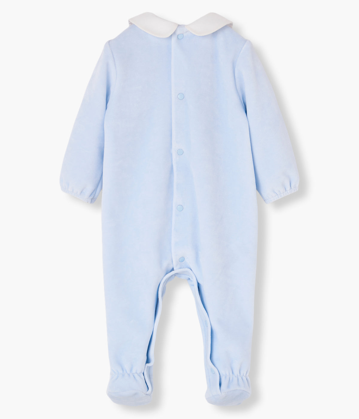 Vista costas do babygrow em veludo azul da Paz Rodríguez para bebé e recém-nascido(a). Gola redonda cortada em tecido branco. Coelho com pompom na frente. Abertura nas costas.