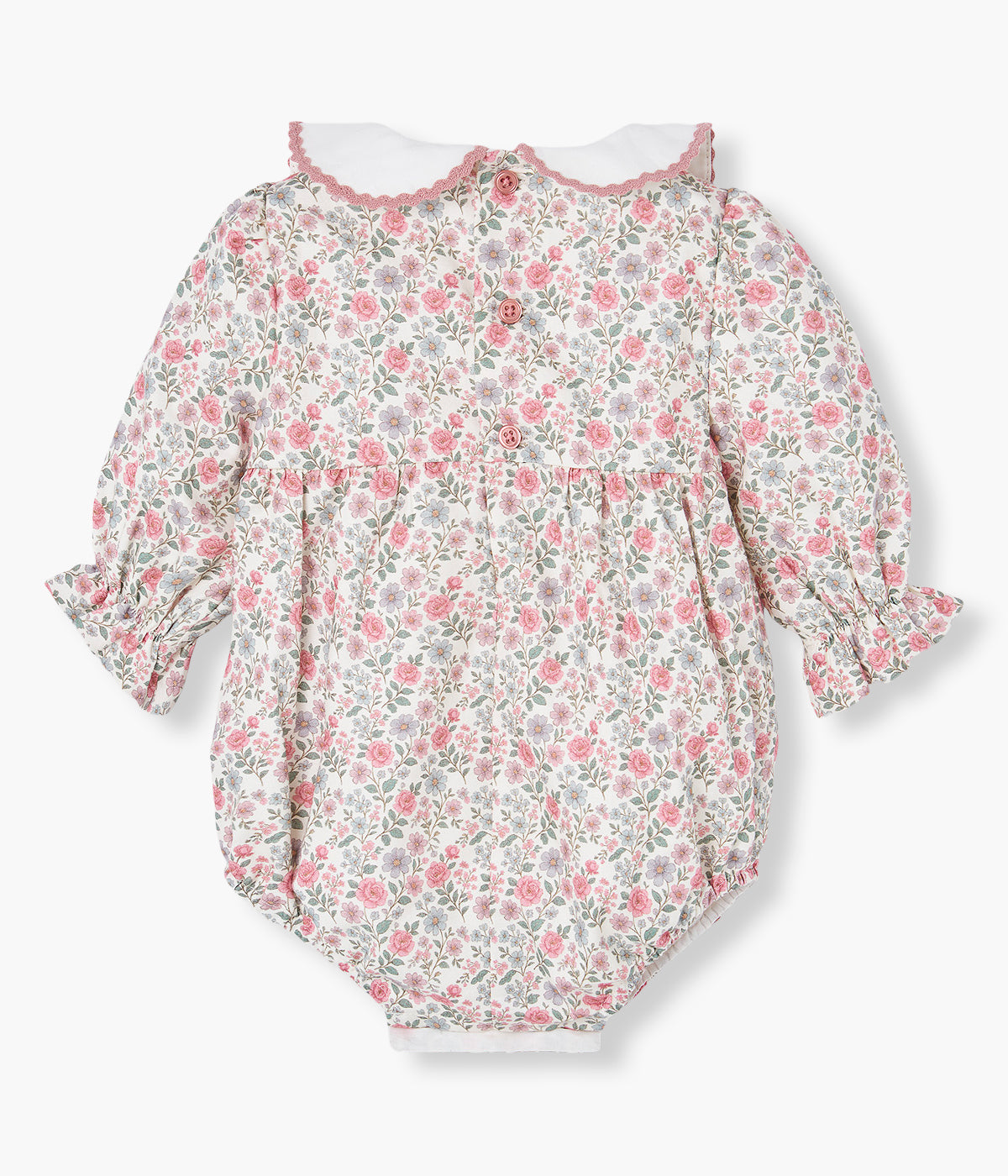 Vista costas fofo em algodão pérola da Paz Rodríguez para bebé menina e recém-nascida. Gola em tecido branco com rebordo em renda e pequenas flores bordadas. Fofo com padrão floral total.