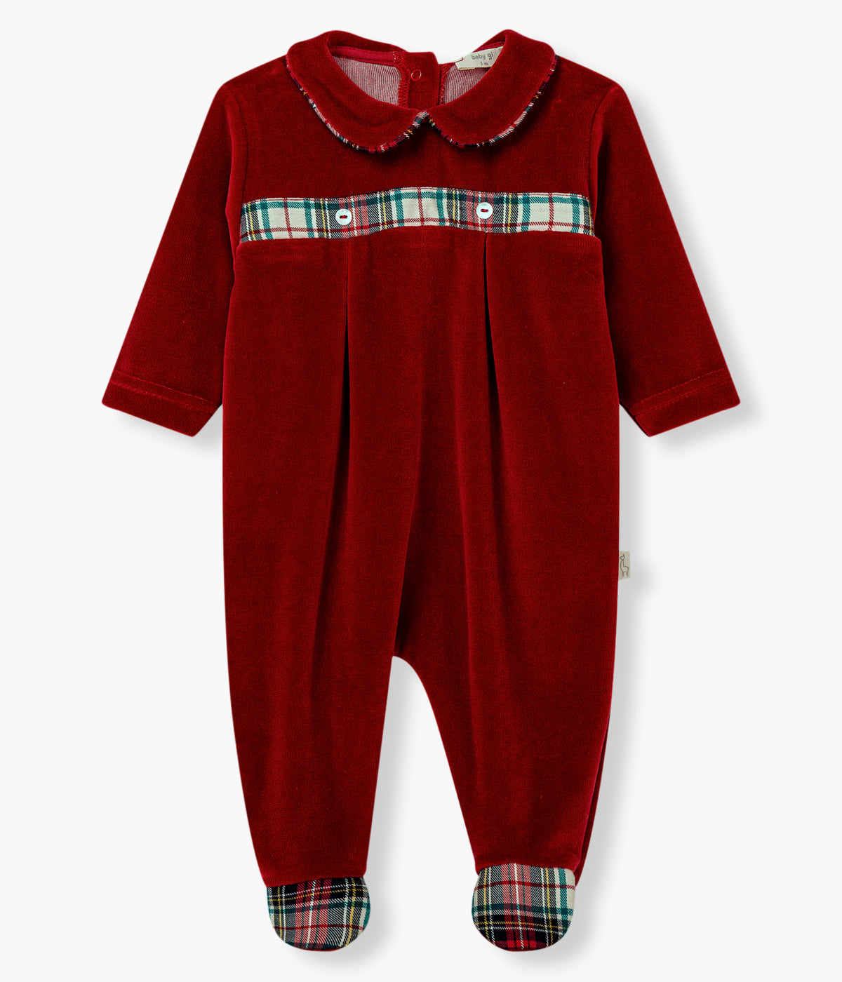 Vista frontal do babygrow em veludo vermelho-escuro da Baby Gi para bebé e recém-nascido(a). Gola redonda cortada, pés e faixa no peito com padrão xadrez em tons de vermelho, verde e bege. Abertura nas costas e entrepernas.