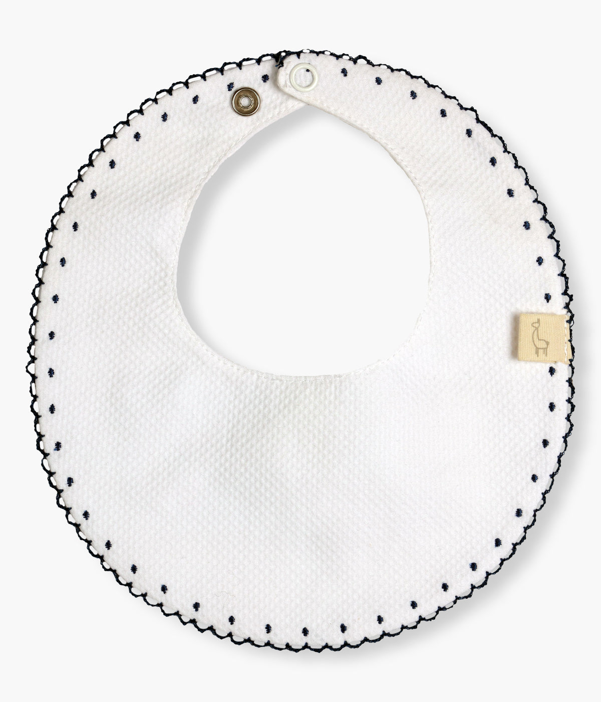 Babete impermeável branca redonda da Baby Gi para bebé e recém-nascido(a), 100% algodão. Rebordo a toda a volta com picueta azul e bolinhas bordadas.