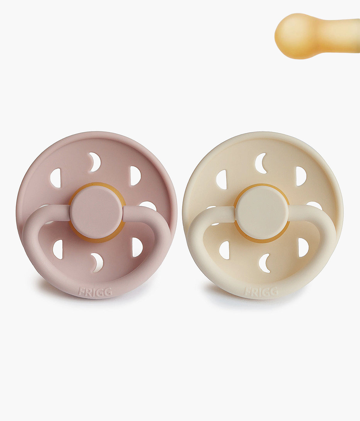 Pack de 2 Chupetas Frigg Moon Phase de design inspirado no movimento da lua. Conjunto de chupetas fabricado na Dinamarca composto por 1 chupeta rosa (blush) e 1 chupeta pérola (cream) com tetina redonda em borracha natural (látex).