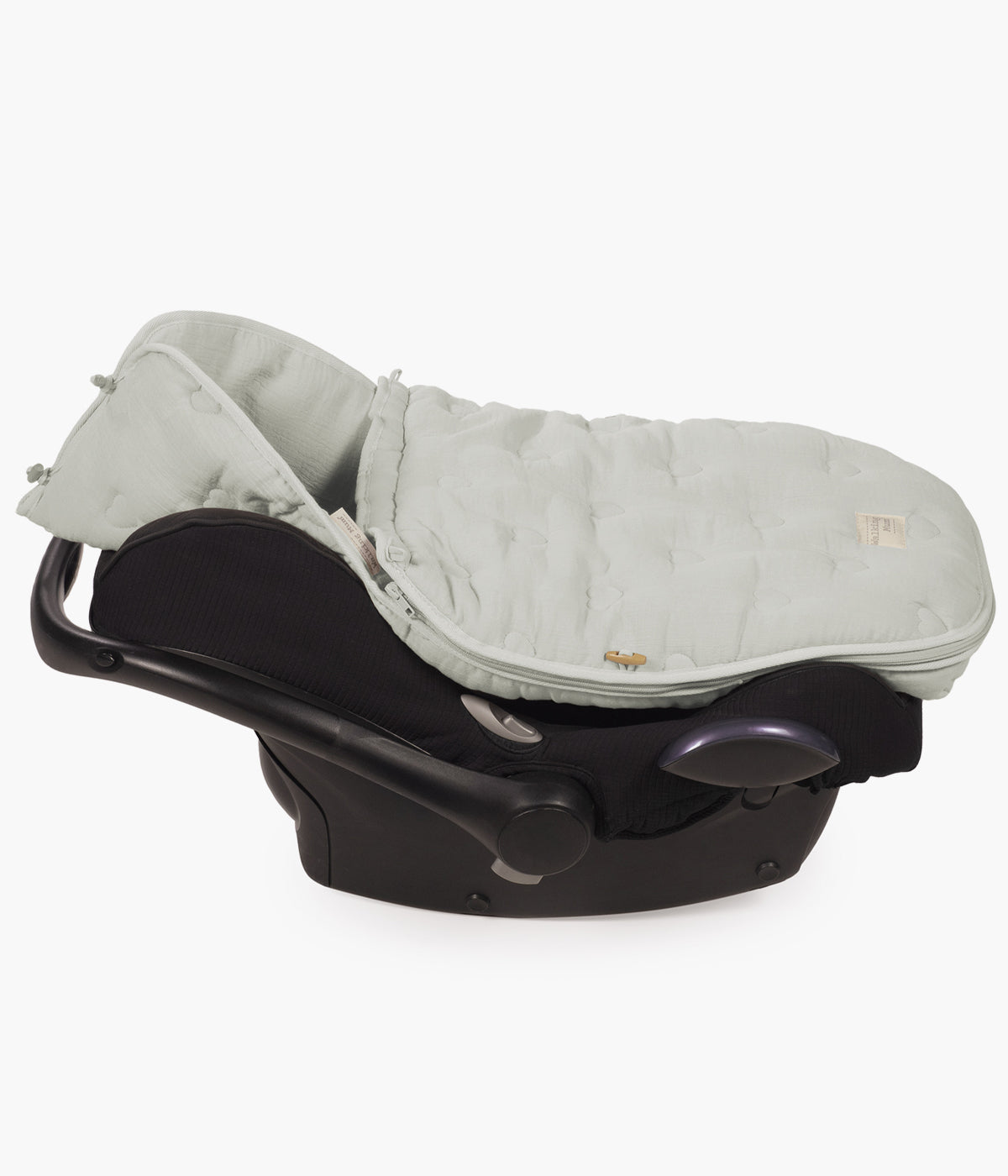 Saco de dormir 2 em 1 Walking Mum Sintra verde aplicado numa cadeira auto.