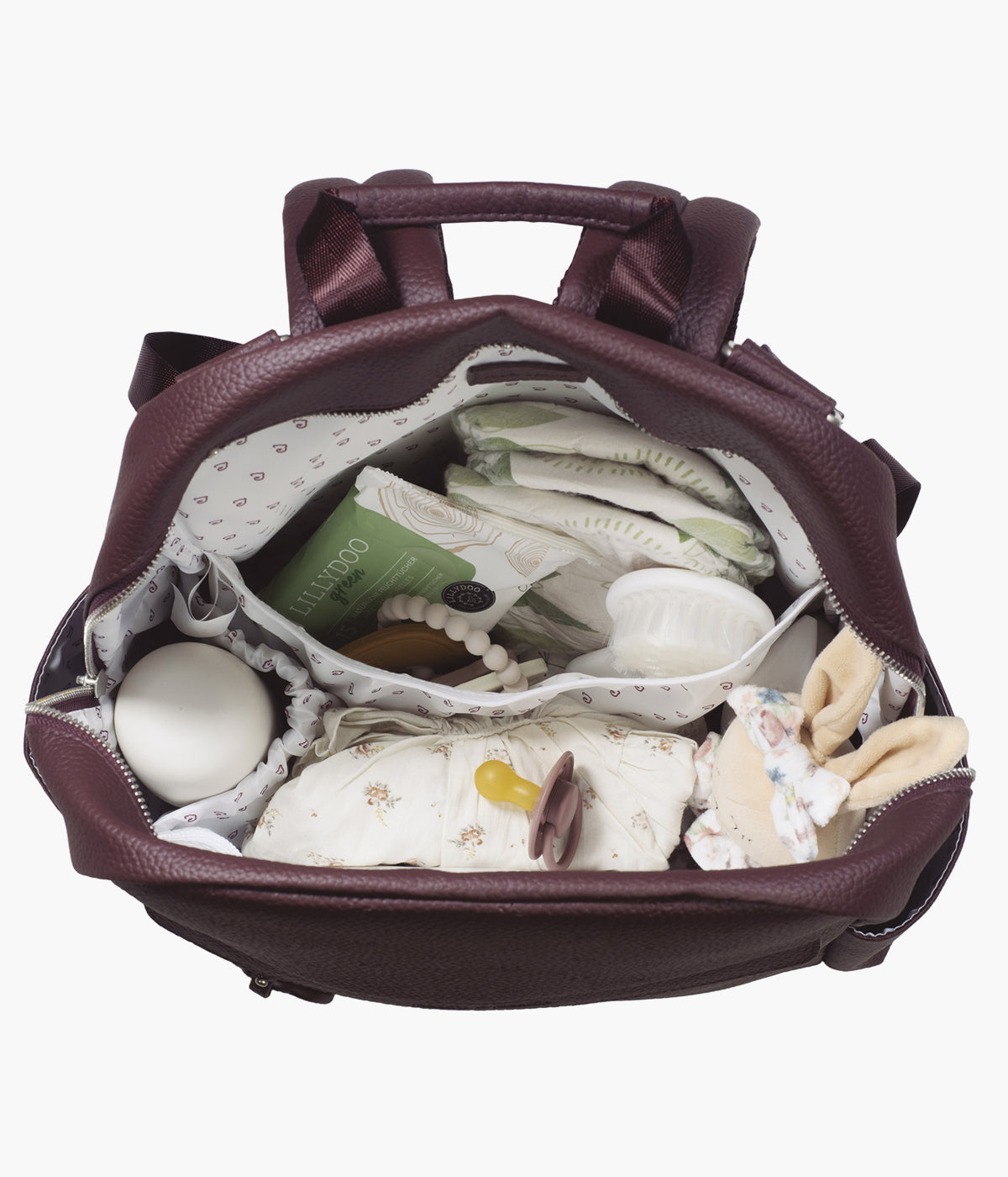 Mochila de Maternidade Pasito a Pasito London Cherry em polipele de cor cereja aberta com artigos de bebé.
