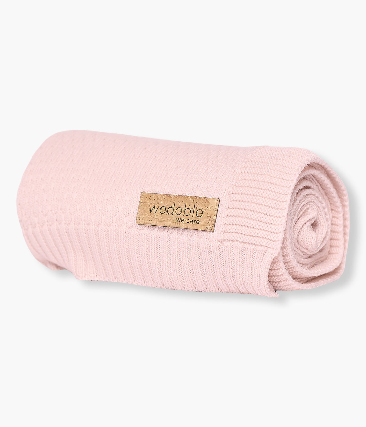 Manta em malha de lã merino cor-de-rosa da Wedoble para bebé menina e recém-nascida. Suave manta de formato retangular com detalhes na malha.