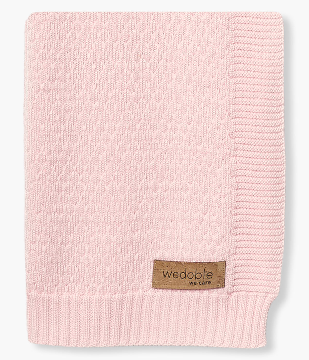 Manta em malha de lã merino cor-de-rosa da Wedoble para bebé menina e recém-nascida. Suave manta de formato retangular com detalhes na malha.