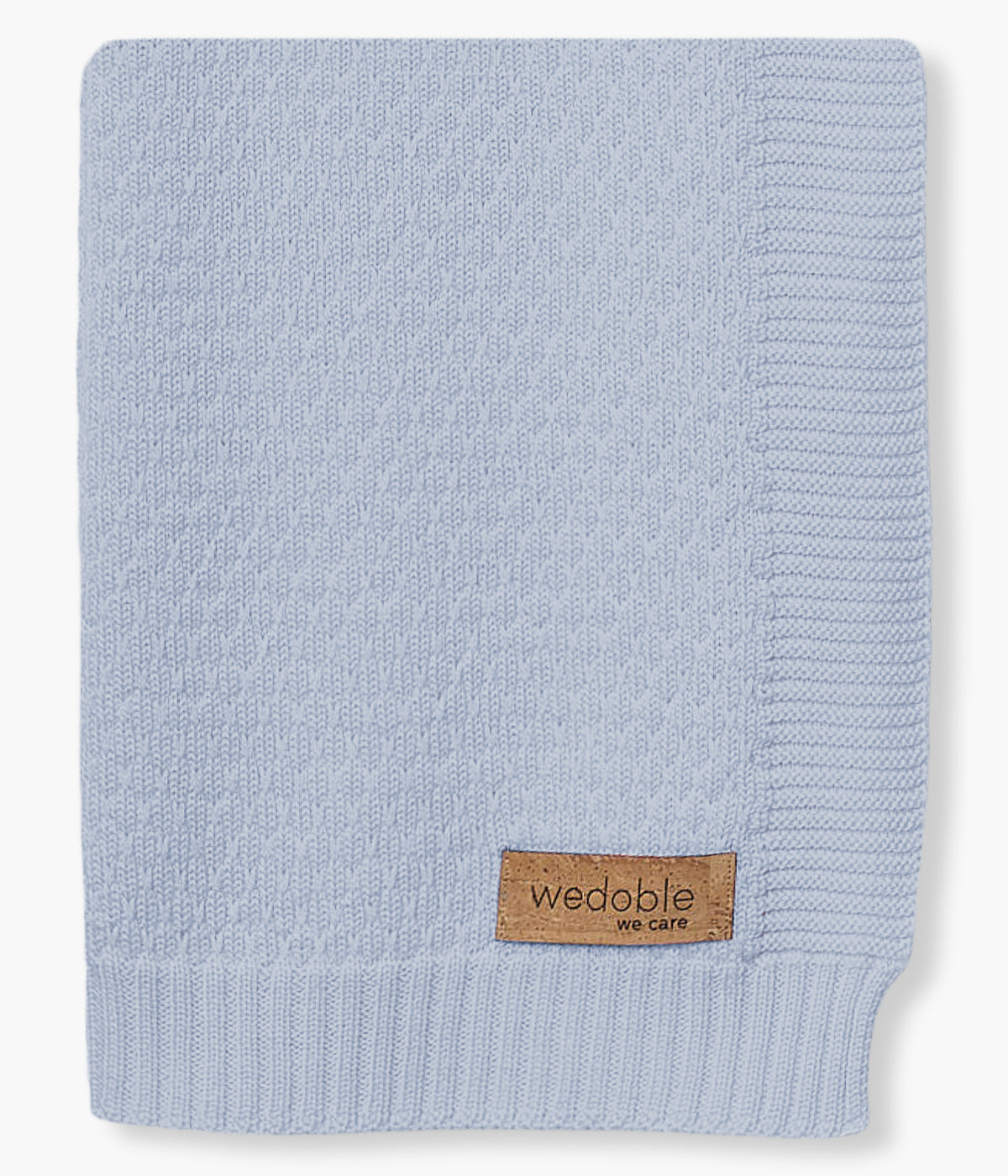 Manta em malha de lã merino azul da Wedoble para bebé menino e recém-nascido. Suave manta de formato retangular com detalhes na malha.