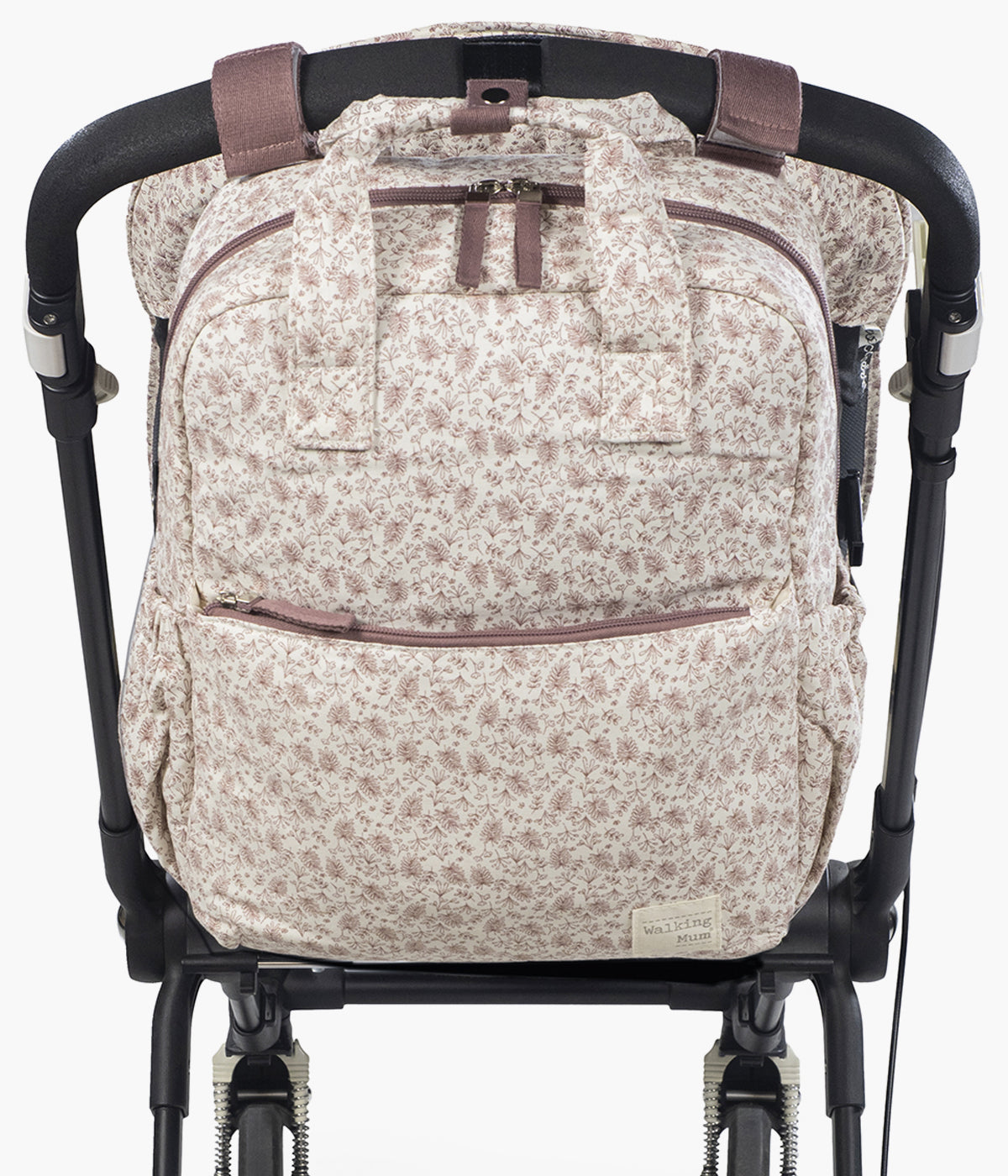 Mochila de Maternidade Walking Mum Gala Cerise pendurada no carrinho.