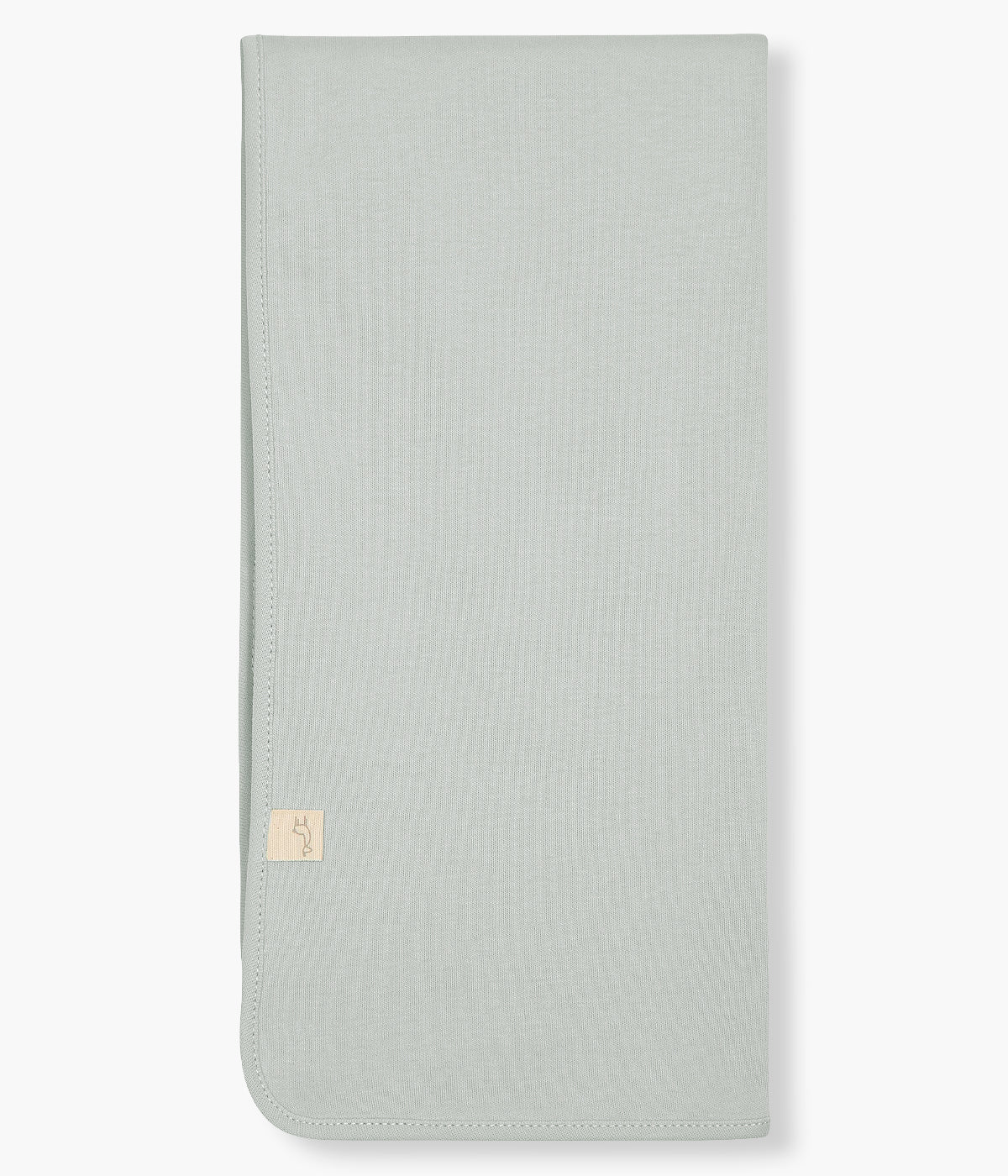 Vistra de tras da fralda verde-menta da Baby Gi para bebé e recém-nascido(a), 100% algodão. Detalhe no canto com tecido em piquet ondulado branco com pequenas pintinhas bordadas.