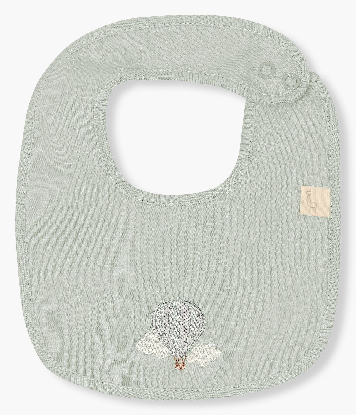 Vista frontal da babete impermeável verde da Baby Gi para bebé e recém-nascido(a), 100% algodão. Elegante babete de formato retangular com balão ar quente bordado na frente.