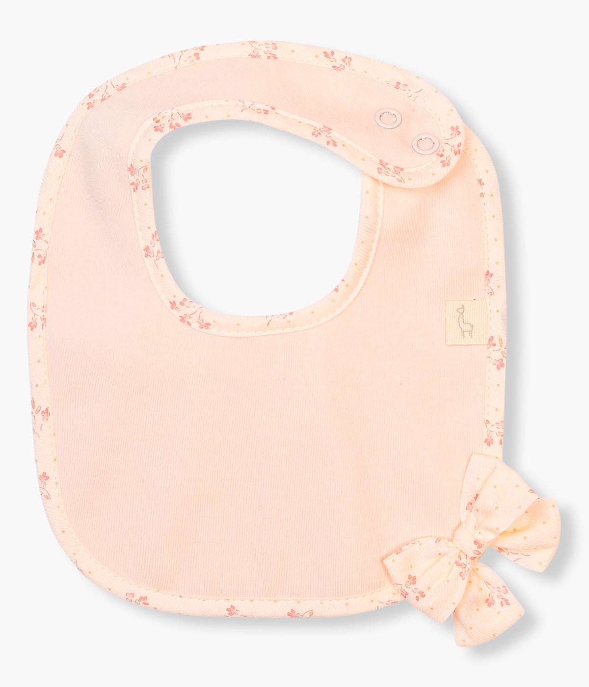 Vista frontal da babete rosa da Baby Gi para bebé menina e recém-nascida, 100% algodão. Elegante babete de formato quadrado com laço e contornos com padrão pequenas flores.