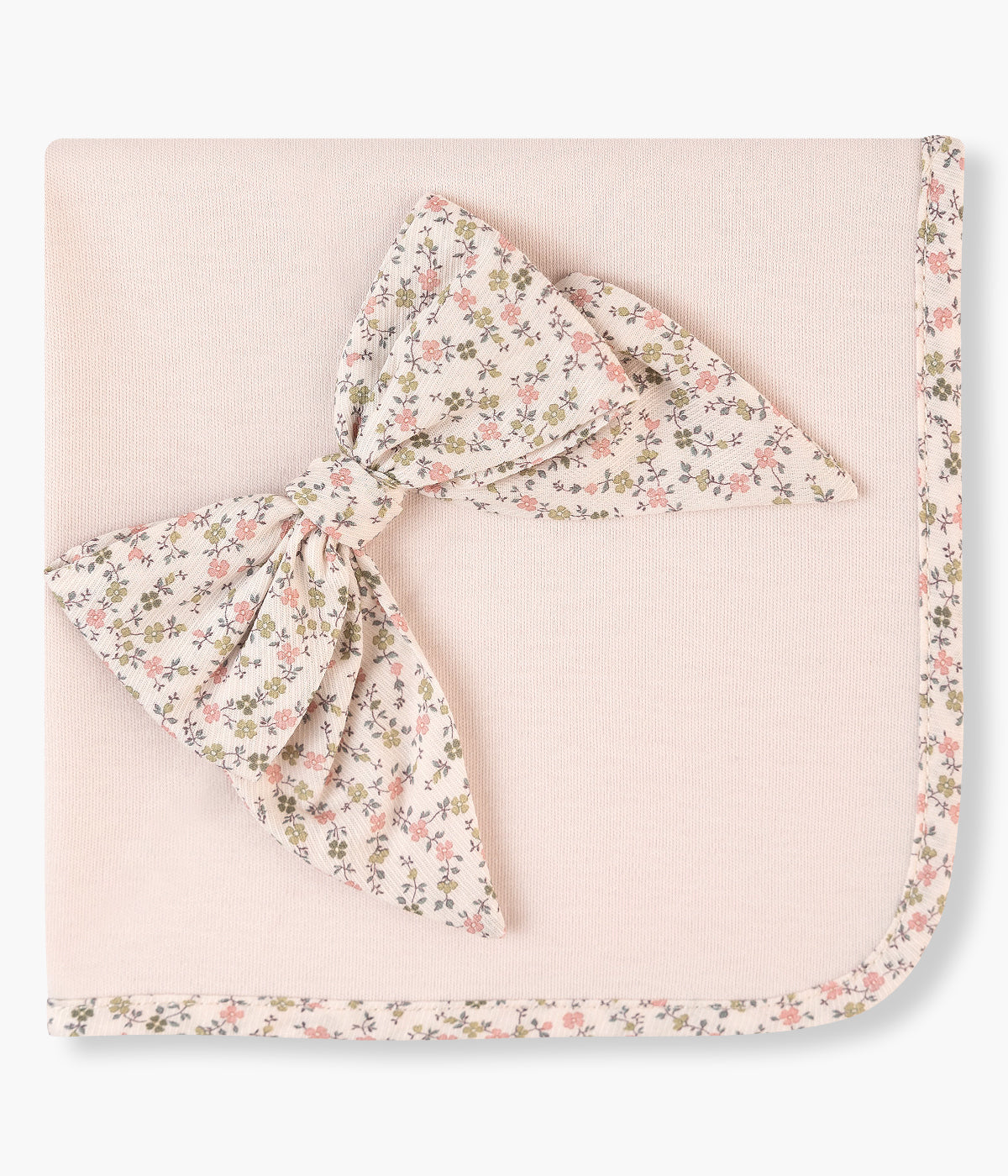 Fralda rosa da Baby Gi para bebé menina e recém-nascida, 100% algodão. Detalhe no canto e rebordo a toda a volta com aplicação em tecido de padrão floral com laço a combinar.