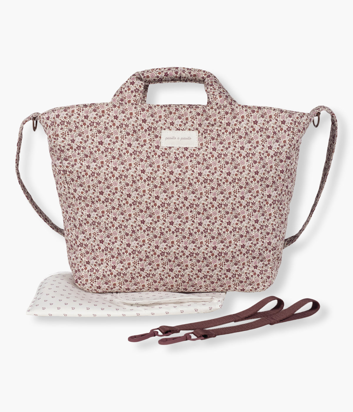 Bolsa de passeio Cherry Flowers da Pasito a Pasito com exterior em algodão impermeável de padrão floral em tons de cor-de-rosa. Charmosa e prática, pensada para mães que procuram uma bolsa funcional sem excluir a elegância.