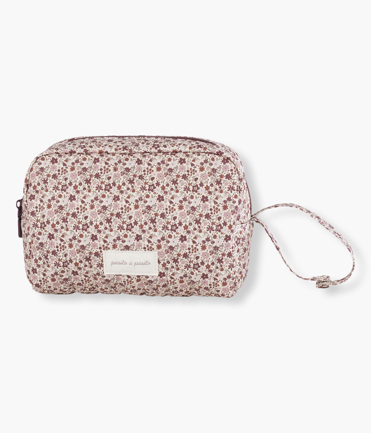 Necessaire Cherry Flowers da Pasito a Pasito, pequena bolsa com exterior em algodão impermeável com padrão floral em tons de rosa e interior em PVC. Compacto, prático e elegante, é o acessório essencial para transportar organizadamente todos os produtos de higiene da bebé fora de casa.