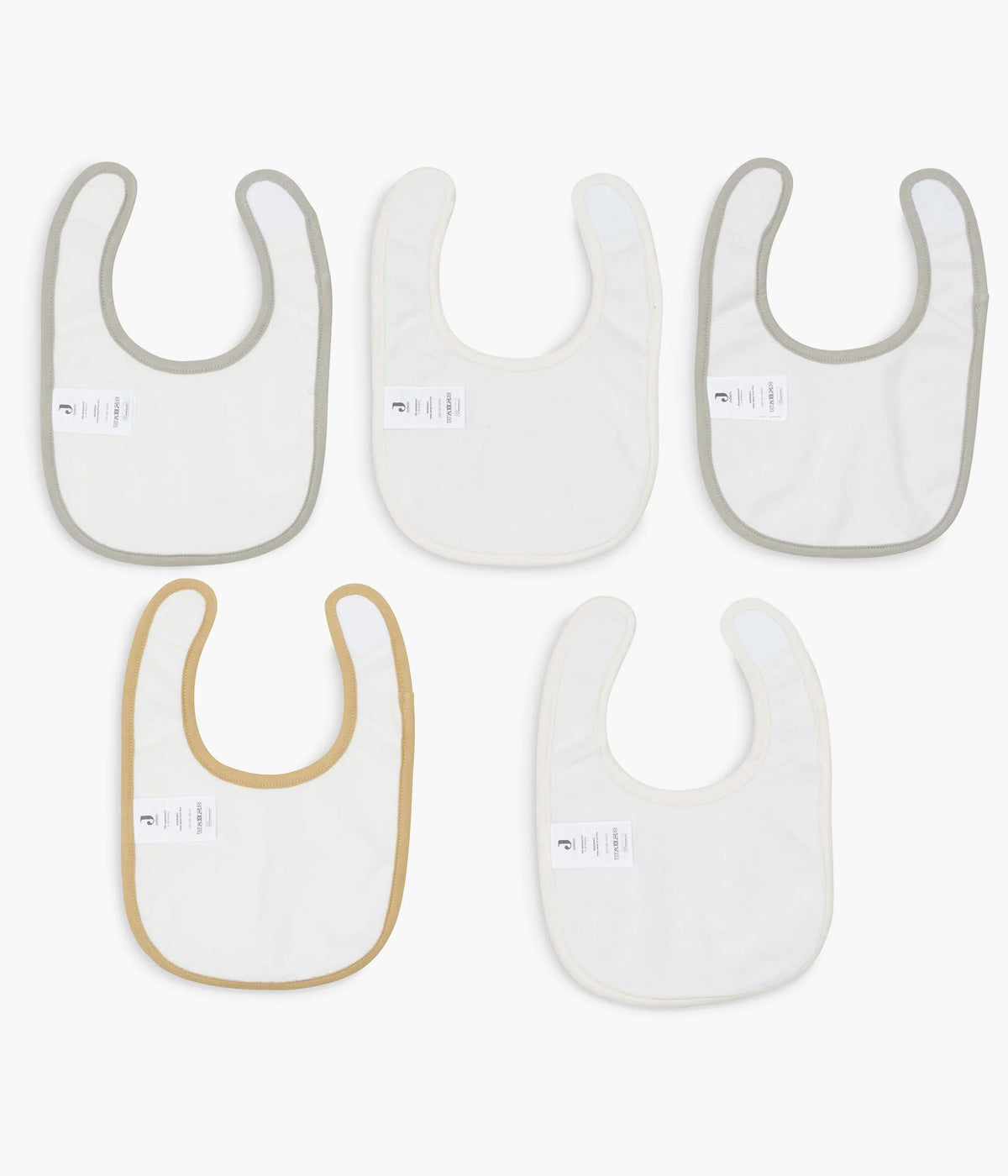 Pack de 5 babetes impermeáveis Tiny Park da Jollein, 100% algodão. Perfeitas para as refeições do bebé, possuem um fecho em velcro para colocar e retirar facilmente. Práticas babetes que mantêm a roupa limpa e seca, combinando funcionalidade e um toque encantador com os seus adoráveis padrões com elementos da natureza.
