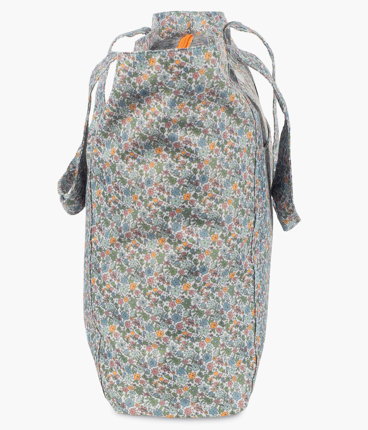 Vista de lateral da bolsa da praia Summer Flowers da Walking Mum para bebé menina. Prática bolsa com padrão floral ideal para os dias de praia, piscina ou passeios em família. Leve e resistente, oferece grande capacidade de arrumação e uma base em rede pensada para evitar a acumulação de areia no interior.