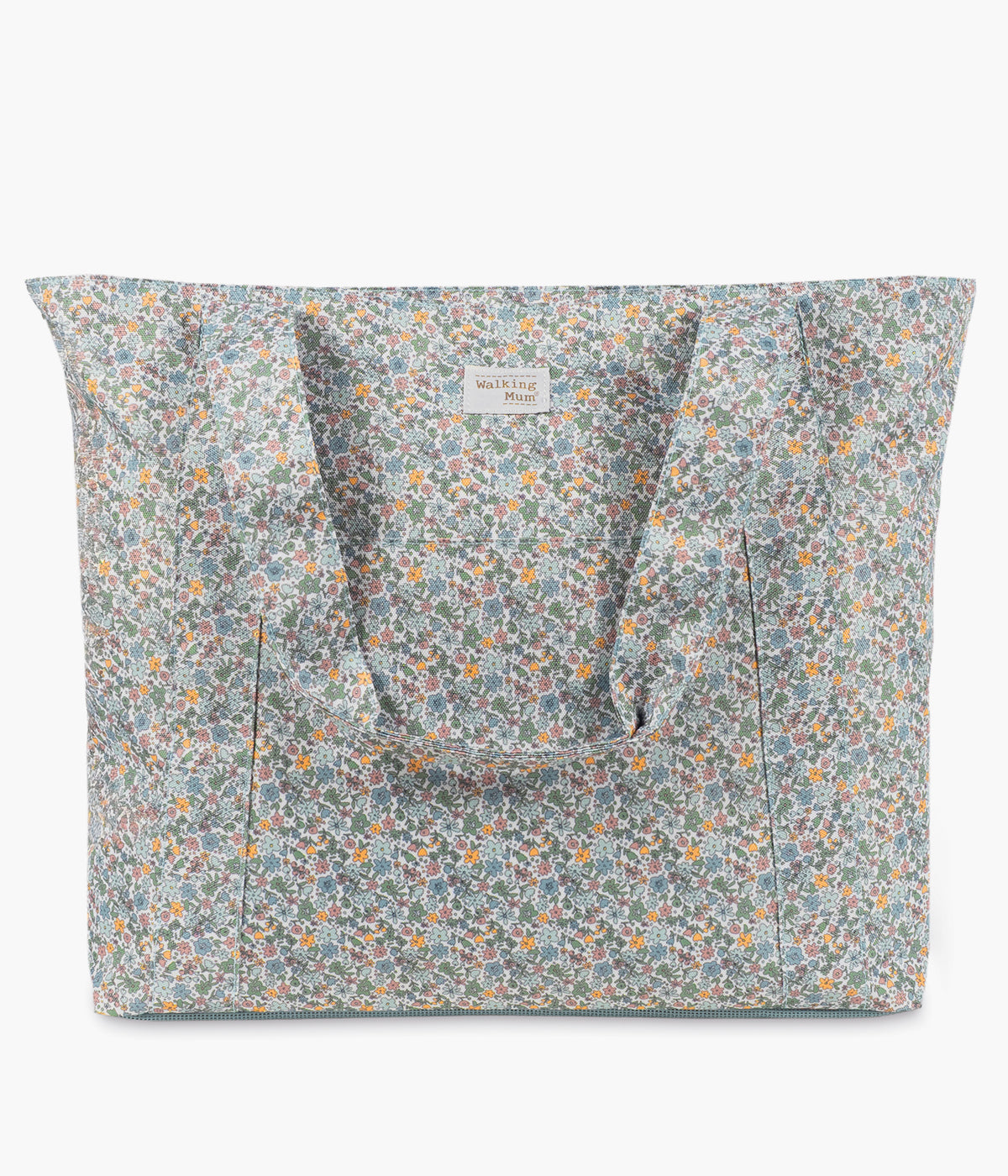Vista de frente da bolsa da praia Summer Flowers da Walking Mum para bebé menina. Prática bolsa com padrão floral ideal para os dias de praia, piscina ou passeios em família. Leve e resistente, oferece grande capacidade de arrumação e uma base em rede pensada para evitar a acumulação de areia no interior.