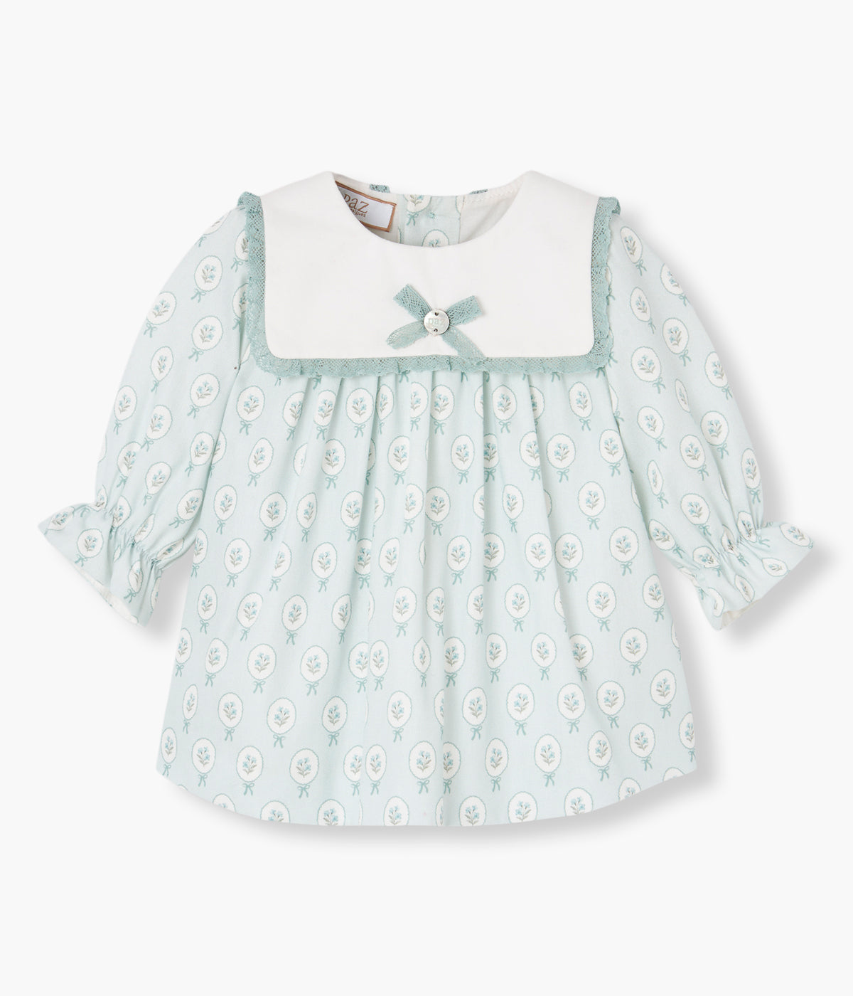 Vista frontal do vestido com tapa fraldas em algodão da Paz Rodríguez para bebé menina e recém-nascida.