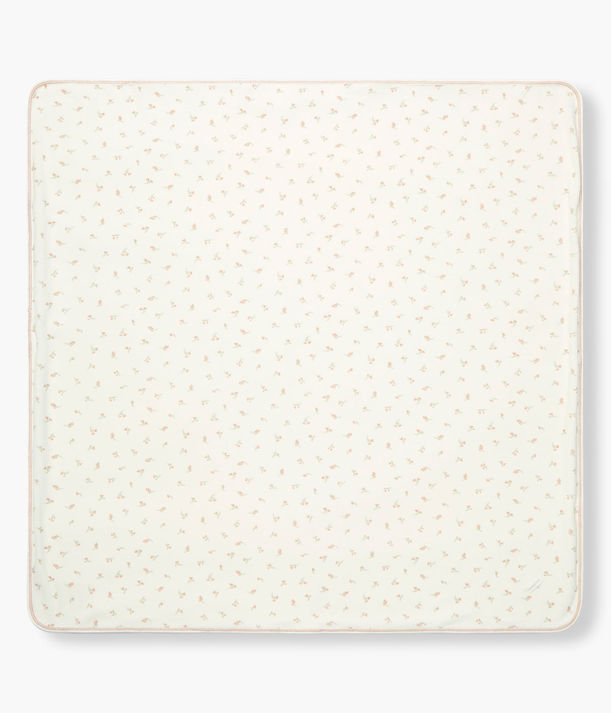 Vista frontal da manta de dupla face em veludo e algodão pérola da Laranjinha para bebé menina e recém-nascida. Uma face em veludo com elegante padrão floral e outra face lisa em algodão.