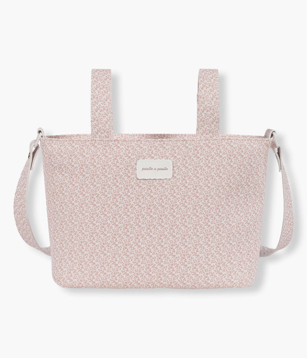 Vista frontal da bolsa de passeio Maison Tender da Pasito a Pasito com o padrão Flowers. Prática bolsa de design elegante com um padrão floral rosa e com um formato compacto e funcional para os passeios com a bebé.