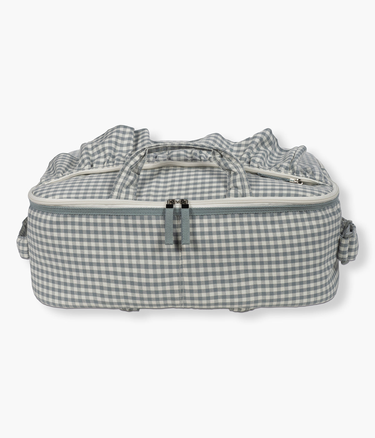 Mala de Maternidade Walking Mum Praliné Vichy Matcha pousada numa superficie.