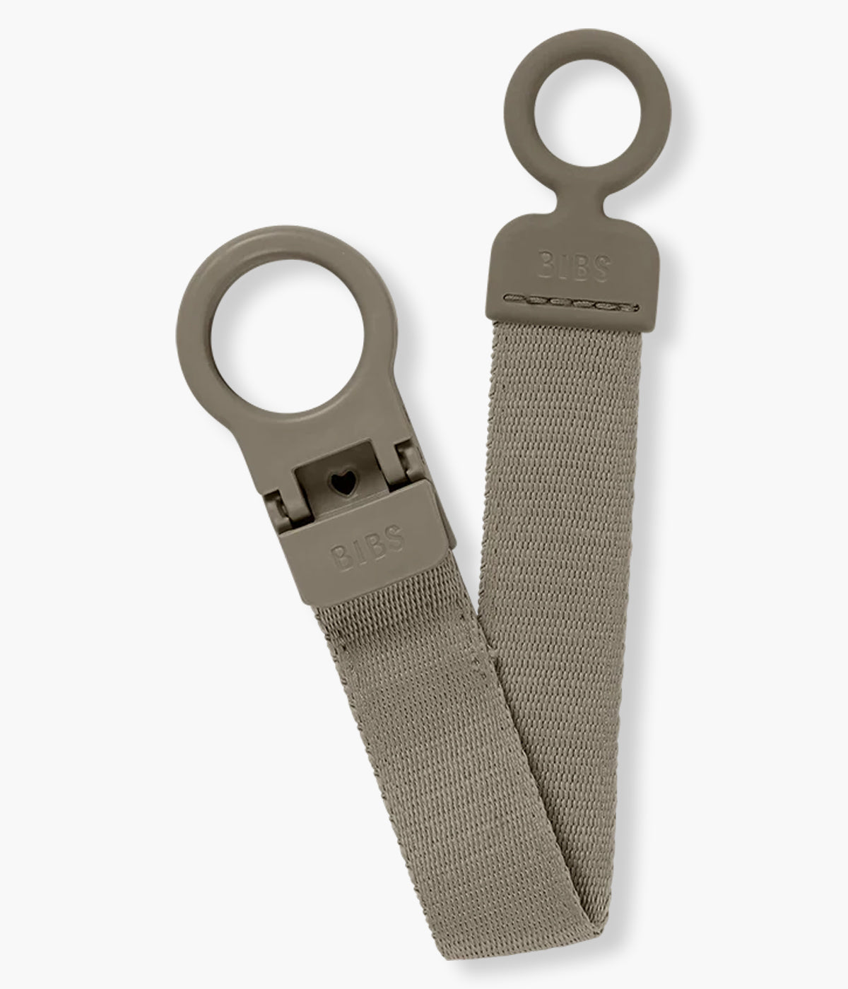 Prende chupetas para bebé Bibs Loop em castanho (dark oak). Essencial que facilita o dia a dia: mantém a chupeta sempre à mão e longe do chão, com fecho de utilização rápida, manuseável com uma só mão. Anel em silicone, compatível com todas as chupetas Bibs.