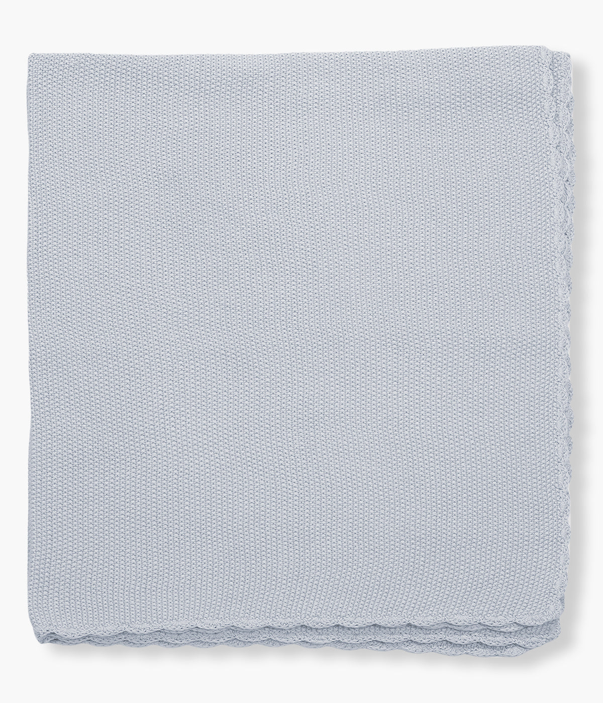 Manta de malha em algodão tricot azul da Pasito a Pasito para bebé menino e recém-nascido com rebordo ondulado.