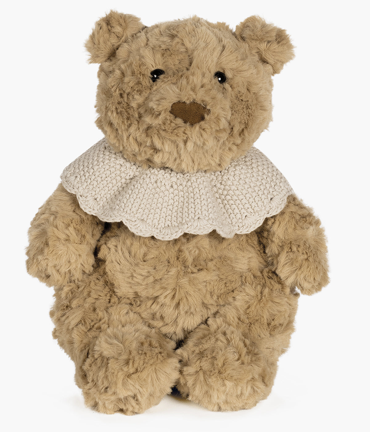 Urso de peluche bege da Pasito a Pasito para bebé. Delicado urso com textura aveludada ideal para o contacto com a pele sensível do bebé. O detalhe da gola em tricot, numa tonalidade delicada de bege, confere um toque clássico e amoroso ao seu visual, tornando-o ainda mais especial.