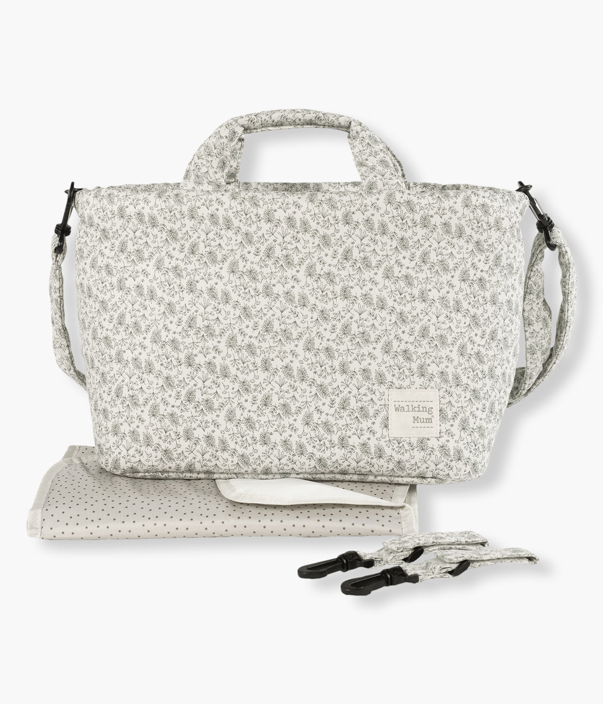 Bolsa de passeio Gala Mint da Walking Mum. Com um encantador padrão ramos em tons de verde com fundo pérola, esta bolsa de passeio possui um exterior em algodão com tratamento impermeável e oferece ampla capacidade e múltiplos bolsos para organizar tudo o que o bebé e os pais precisam nos passeios. Inclui resguardo portátil.