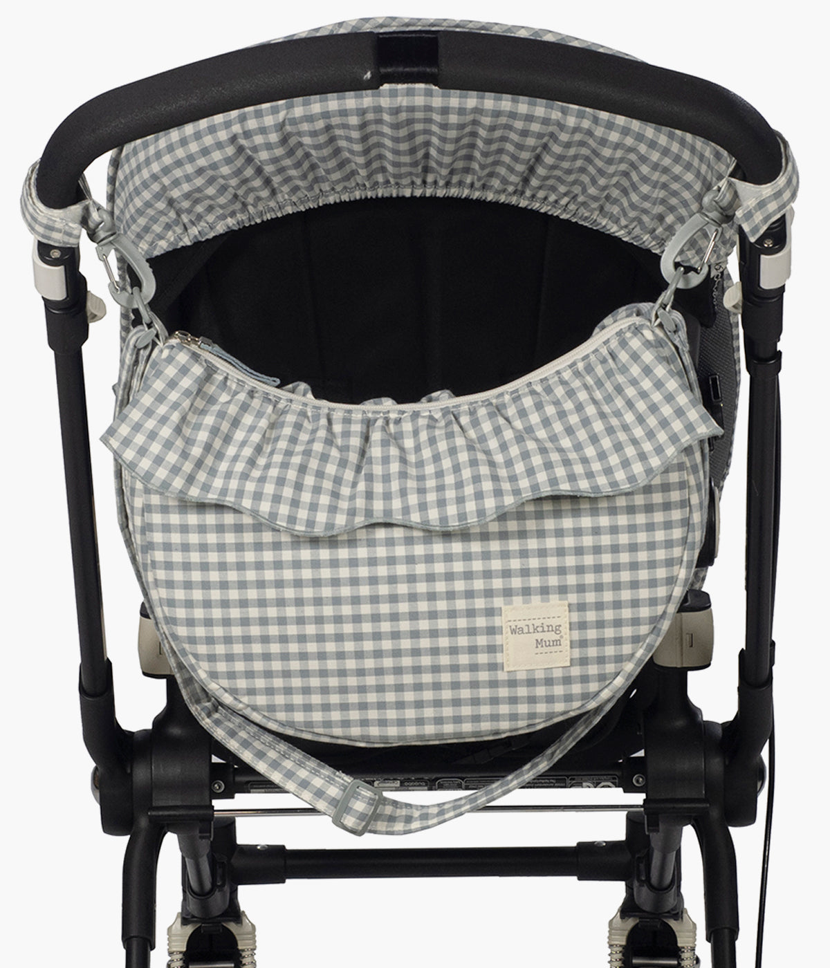 Bolsa de Passeio Gôndola Walking Mum Praliné Vichy Matcha pendurada no carrinho.